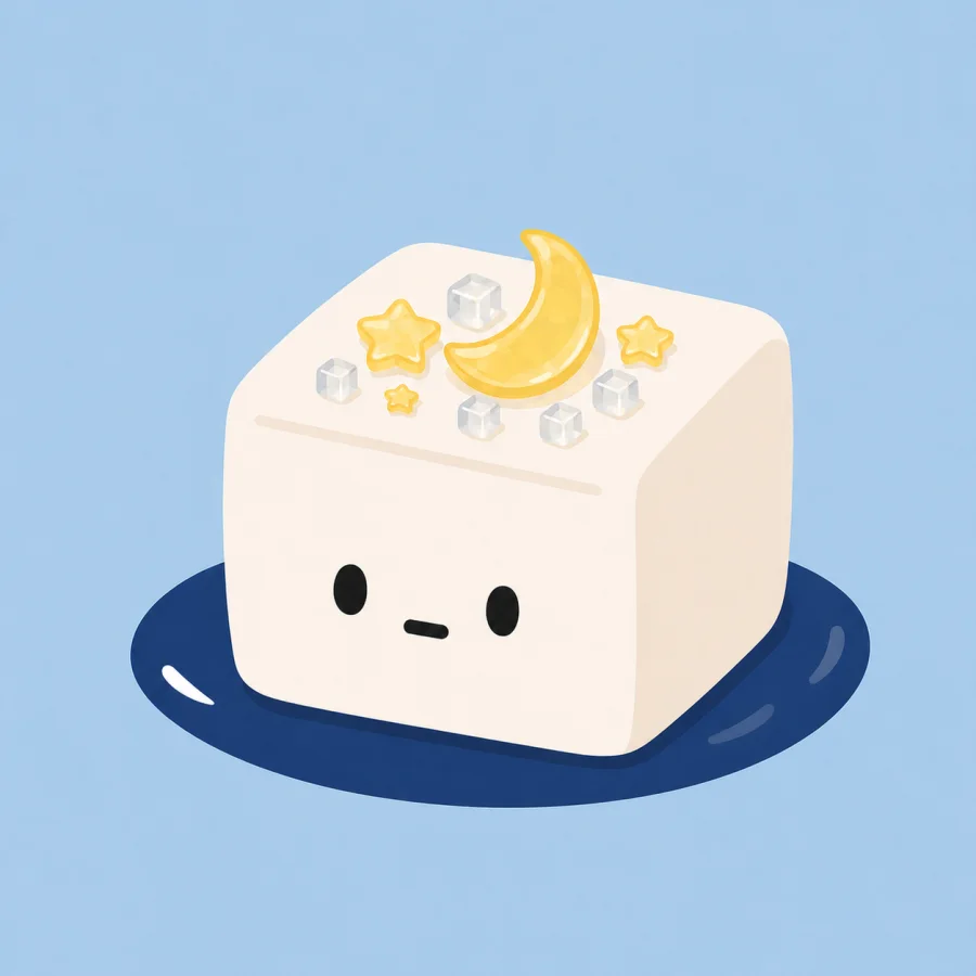 A cute tofu character on a navy plate with ginger and sesame.